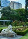 A statue of a lion guards the flower beds in the Royal Botanic Gardens in Sydney. Royalty Free Stock Photo