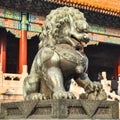 Statue of a lion near the gate in Peking Palace