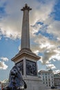 Statue of a lion and Nelson column in Trafalgar Square, London Royalty Free Stock Photo