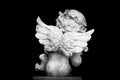 Statue of Little Cupid playing harp Royalty Free Stock Photo
