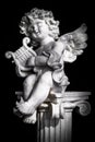 Statue of Little Cupid playing harp