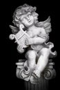 Statue of Little Cupid playing harp