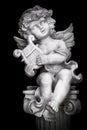 Statue of Little Cupid playing harp Royalty Free Stock Photo