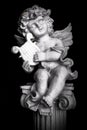 Statue of Little Cupid playing harp