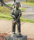 Statue of a little girl with a watering can -Our Children`s Memorial Garden