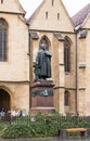 The statue of Loi Georg Daniel Teutsch in front of Lutheran Cathedral of Saint Mary in a rainy day. Sibiu city in Romania Royalty Free Stock Photo