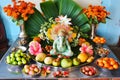 Statue Of Lord Ganesha sitting on golden asana with fruits and flowers. Happy Ganesh Chaturthi Royalty Free Stock Photo