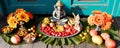 Statue Of Lord Ganesha sitting on golden asana with fruits and flowers. Happy Ganesh Chaturthi Royalty Free Stock Photo