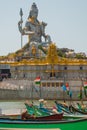 Statue of Lord Shiva in Murudeshwar. Fishing boats. Temple in Karnataka, India