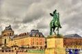 Statue of Louis XIV in front of the Palace of Versailles Royalty Free Stock Photo