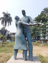 Statue of love,made of cement male and female playing love hand to hand .