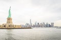 Statue with Lower Manhattan Futuristic Buildings and Towers in  Background. Lady Liberty in New York City Royalty Free Stock Photo