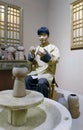 Statue of male craftsman making pottery in Anthropology Museum Of Guangxi, adobe rgb