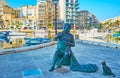 The statue of Maltese fisherman, St Julian`s, Malta