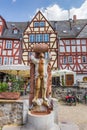 Statue of a man drinking from a barrel in Limburg