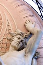 Statue man holding balcony historic buildings detail