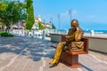 Statue of a man reading a book at Gardone Riviera in Italy