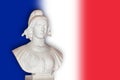 Statue of Marianne, France republic symbol french flag background Royalty Free Stock Photo