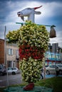 A statue of Matolek the Billy Goat, dressed in flowers, in Pacanow, Poland.