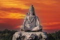 Statue of meditating Hindu god Shiva on the Ganges River at Rishikesh village in India