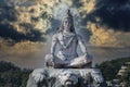 Statue of meditating Hindu god Shiva on the Ganges River at Rishikesh village in India