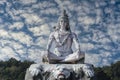 Statue of meditating Hindu god Shiva on the Ganges River at Rishikesh village in India