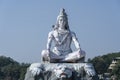 Statue of meditating Hindu god Shiva on the Ganges River at Rishikesh village in India