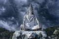 Statue of meditating Hindu god Shiva on the Ganges River at Rishikesh village in India Royalty Free Stock Photo
