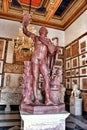 Statue Faun in rouge antique marble in Museum Capitolini, Rome Italy