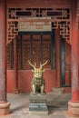 Statue of mystical Chinese guardian lion in Wenshu Temple. Royalty Free Stock Photo