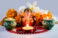 A statue of a mythological elephant god -Ganesha, surrounded by traditional divali lamps