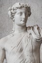 Statue of naked handsome Apollo with a raising hand, Rome, Ital