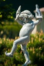 A statue of a naked little boy with two fish in his hands Royalty Free Stock Photo