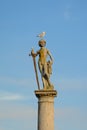 Statue of a naked man with a sword, with a gull on his head in Luxembourg garden, Paris