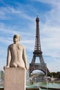 Statue of naked woman looks at Eiffel Tower Royalty Free Stock Photo