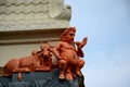 Statue of Nandi bull and one god holding conch at Sri Senpage Vinayagar Hindu temple Singapore