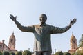 A statue of nelson mandela in front of the presidential palace