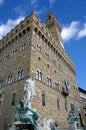 statue of Neptune in the fountain in Florence and Palazzo Vecchio known as Old Palace Royalty Free Stock Photo