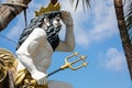 Statue of Neptune, god of freshwater and the sea in Roman religion, observing with his hand on his forehead and the trident. He is