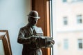 A statue of a nineteenth century photographer with old fashioned photo camera