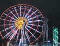 Statue of Nino and Ali at night on the carousel background and alphabetic tower. Batumi,Georgia at august of 2018 Royalty Free Stock Photo