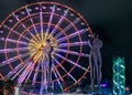 Statue of Nino and Ali at night on the carousel background and alphabetic tower. Batumi,Georgia at august of 2018 Royalty Free Stock Photo