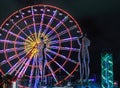 Statue of Nino and Ali at night on the carousel background and alphabetic tower. Batumi,Georgia at august of 2018 Royalty Free Stock Photo