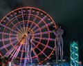 Statue of Nino and Ali at night on the carousel background and alphabetic tower. Batumi,Georgia at august of 2018 Royalty Free Stock Photo