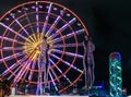 Statue of Nino and Ali at night on the carousel background and alphabetic tower. Batumi,Georgia at august of 2018 Royalty Free Stock Photo