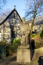 A statue of Norwegian writer Arne Gaborg behind Stavanger cathedral in city park, Stavanger