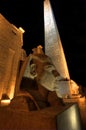 Statue and obelisk at Luxor temple at night Royalty Free Stock Photo