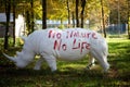 Statue off a white rhino or rhinoceros in the woodland