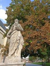 Statue of an old man holding a human skull, Trnava, Slovakia Royalty Free Stock Photo