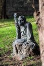 Statue of an old man, sitting on a rock in the garden of the Nan Tien Temple, Wollongong, Australia Royalty Free Stock Photo